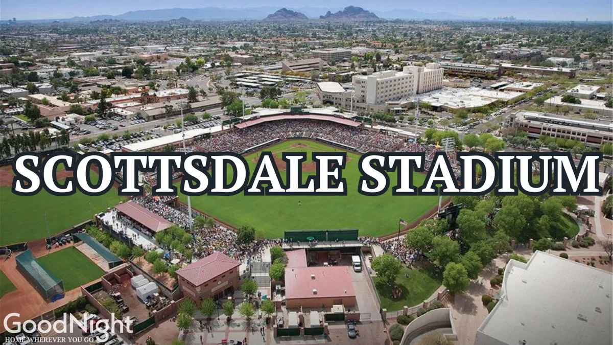 A lively scene at Scottsdale Stadium, with a crowd of fans watching a baseball game against the scenic backdrop of the local landscape. The atmosphere is festive and vibrant, making it clear this is a prime spot for local family entertainment.